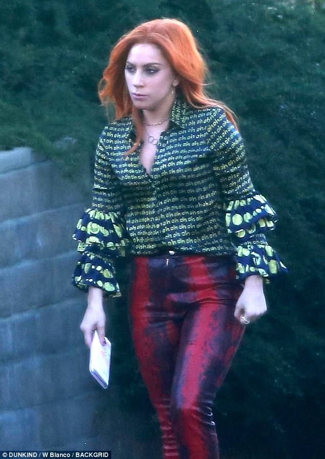 Lady Gaga rocks orange wig and ruffled neon ‘Oh’ blouse on A Star is Born set with Bradley Cooper Lady Gaga rocks orange wig and ruffled neon ‘Oh’ blouse on A Star is Born set with Bradley Cooper
