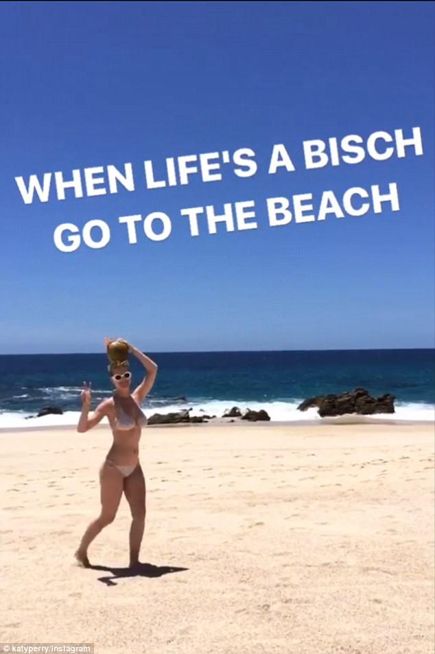Life’s a beach! Katy Perry cavorts solo on the sand in a skimpy string Bikini with a coconut on her head Life’s a beach! Katy Perry cavorts solo on the sand in a skimpy string Bikini with a coconut on her head