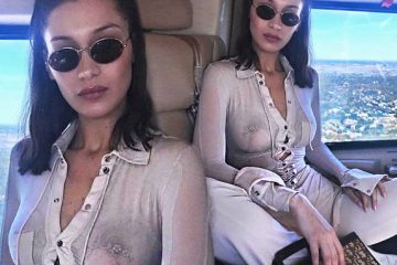 Bella Hadid flaunts bare chest in sheer Henley top while soaring above New York