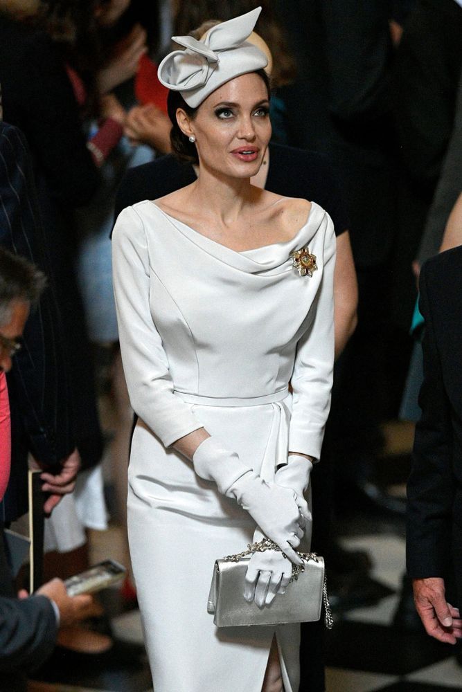 Angelina Jolie takes a Cue from Meghan Markle in Fascinator, Off-the-Shoulder Dress for Royal Event Angelina Jolie takes a Cue from Meghan Markle in Fascinator, Off-the-Shoulder Dress for Royal Event