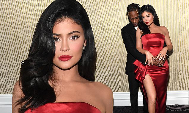 Kylie Jenner is a siren in scarlet as she and Travis Scott embrace backstage at Clive Davis bash Kylie Jenner is a siren in scarlet as she and Travis Scott embrace backstage at Clive Davis bash